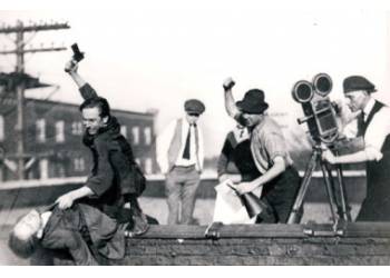 Walt is “attacking” Maxwell; Ub Iwerks is holding the director’s megaphone, and Adolph Kloepper is behind the camera